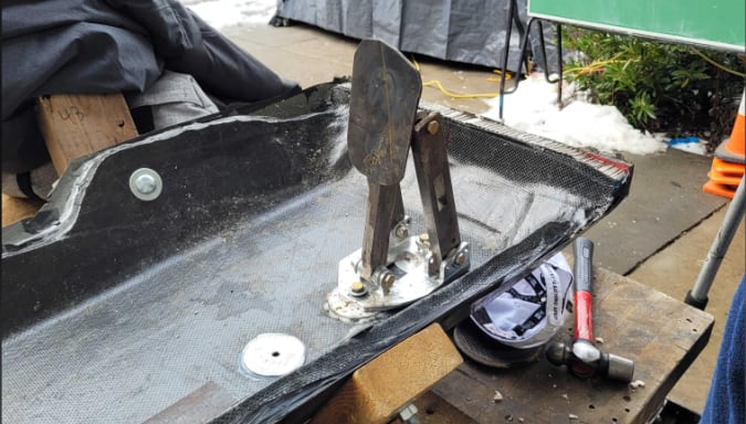 Brake pedal base mounted to a carbon fiber floor mock-up for load testing