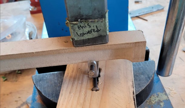 Arbor press load test with a wooden block